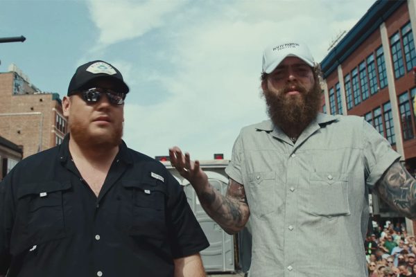 Post Malone and Luke Combs Take an Accidental Porta-Potty Adventure in New ‘Guy for That’ Music Video