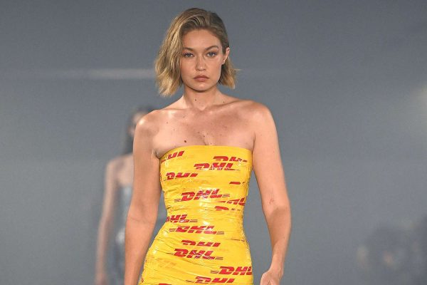 Gigi Hadid Stumbles in Skintight Duct Tape Dress on Vetements Runway, Rebounds Like a Pro