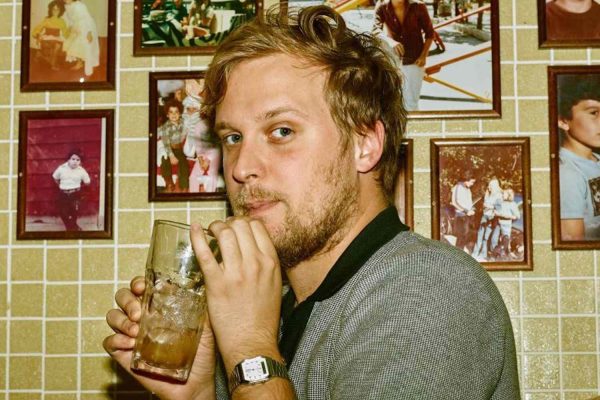 John Early on Why He Covered Aaliyah on Comedy Album, Where He Thinks His ‘Search Party’ Character Is Now (Exclusive)